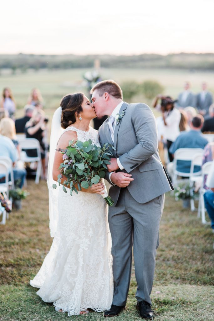 I always have my couples stop at the end of the aisle to give each other their second kiss as husband and wife! The natural posing is just to die for in these images.
